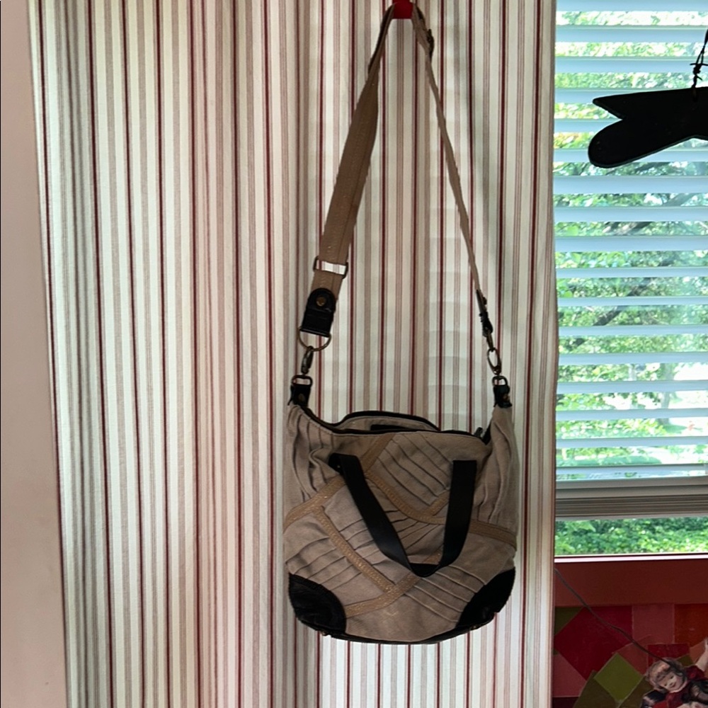 Miss Albright/Anthropologie Beige and gold linen with brown leather accents.